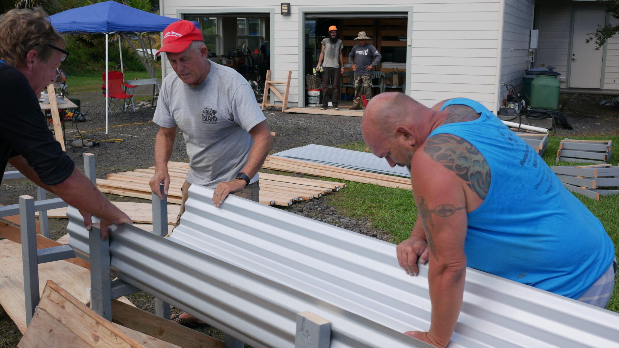 Community members building together at a Pure KNF project